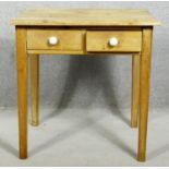 A 19th century pine side table with frieze drawers on square tapering supports. H.63 W.63 D.45cm