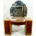 A mid century Art Deco style burr walnut dressing table with cloud shaped bevelled mirror above