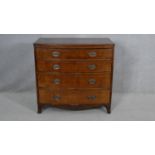 A Regency mahogany bowfronted chest of drawers with crossbanded and ebony strung top on swept