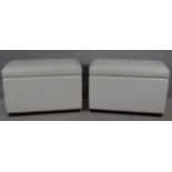 A pair of contemporary ottomans in buttoned faux leather. H.63 L.97 W.51cm