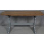 A mid century vintage light elm Ercol refectory style dining table on painted base. H.71.5 L.153 W.