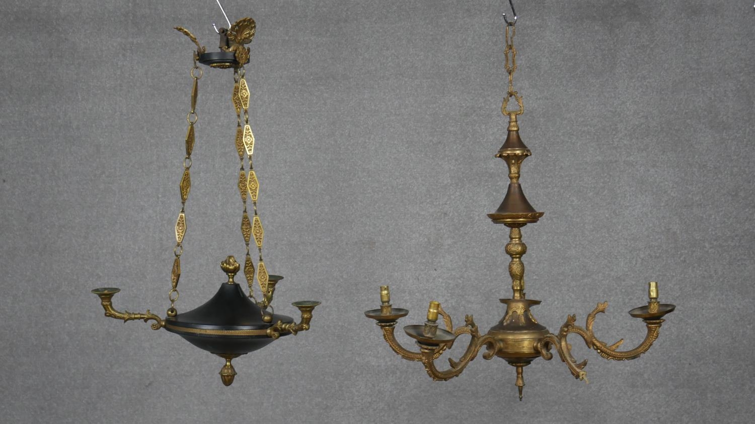 An antique brass and metal three branch ceiling chandelier along with a gilt five branch chandelier.