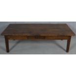 A 19th century French fruitwood low table with frieze drawer on square tapering supports. H.45 L.150