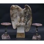 A marble eagle perched with open wings on a plinth base along with a pair of 19th century marble and