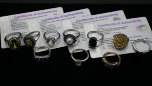 A collection of ten gemset rings, four with certificates. To include a 9ct yellow gold cocktail ring