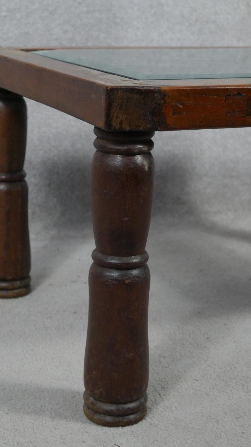 An Indian hardwood occasional table with plate glass on a metal lattice work inset top. H.38 L.68. - Image 5 of 5