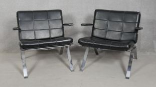 A pair of vintage leather upholstered salon chairs on chrome bases. H.68cm