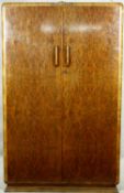 A mid century burr walnut Art Deco style fitted wardrobe on stepped plinth base. H.184 W.120 D.50cm