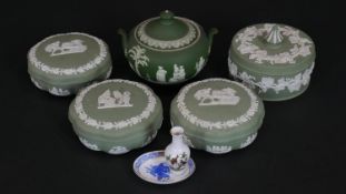 Five Wedgwood sage green Jasperware lidded dressing table jars and sugar bowl along with two items