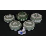 Five Wedgwood sage green Jasperware lidded dressing table jars and sugar bowl along with two items