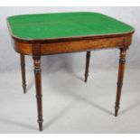 A 19th century mahogany fold over top card table on turned tapering supports. H.73 W.91 D.45cm