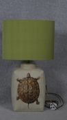 A Porto Romana ceramic lamp with transfer design of a tortoise and green silk shade. H.65