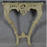 A 19th century carved and painted Rococo style console table with shaped and veined marble top. H.83