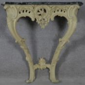 A 19th century carved and painted Rococo style console table with shaped and veined marble top. H.83