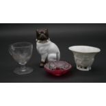 A collection of antique glass and ceramics. Including a porcelain bulldog, an engraved posset glass,