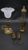 A vintage brass table lamp, a railwayman's storm lantern marked GWR and two brass spring scales. H.