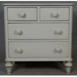 A Victorian style painted chest of two short above two long drawers on turned supports. H.77 W.76