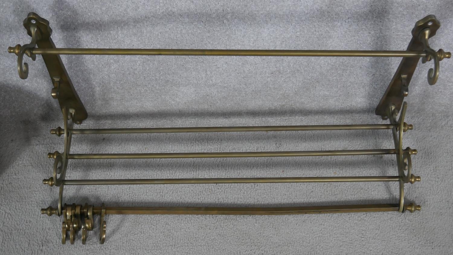 A 19th century brass wall mounted kitchen utilities rack and a heavy brass Victorian swing handled - Image 2 of 6