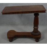 A William IV mahogany bed table with rise and fall action and a pair of adjustable reading slopes