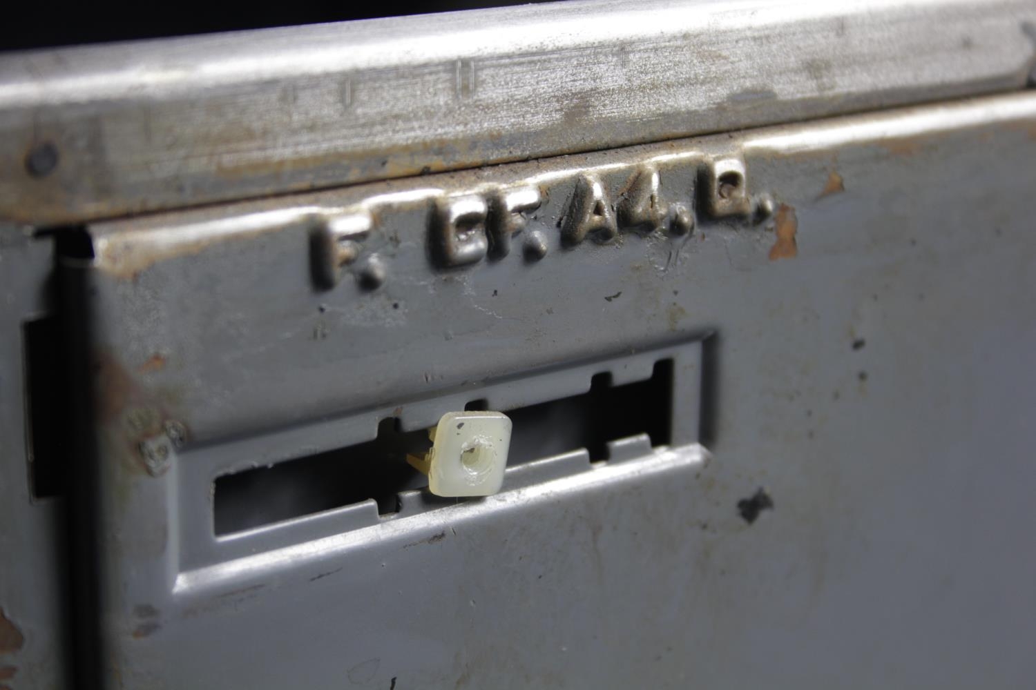 A vintage polished steel filing cabinet with twin brass handles and brass plate to each drawer. H. - Image 7 of 11