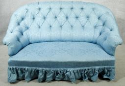 A vintage tub shaped two seater sofa in deep buttoned damask upholstery. H.94 W.150 D.90cm