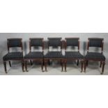 A set of five mid 19th century mahogany dining chairs in striped and studded upholstery on