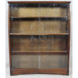 A mid century vintage bookcase with glass sliding doors. H.113 W.91 D.24cm