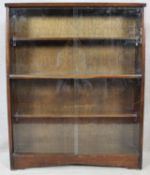 A mid century vintage bookcase with glass sliding doors. H.113 W.91 D.24cm