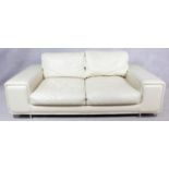 A contemporary two seater sofa in ivory leather upholstery on chrome supports. H.80 W.204 D.104cm