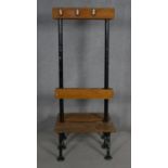 A mid century vintage teak and iron framed school or changing room bench and coat stand. H.171 L.