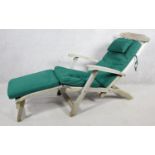 A contemporary weathered teak steamer deck chair by Indian Ocean with fitted cushion. H.100 W.52 L.