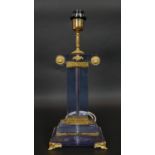 A Neoclassical style glass table lamp with gilt metal mounts resting on scrolling supports. H.49.5cm
