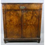 A late 19th century Continental burr walnut chiffonier with frieze drawer above panel doors on