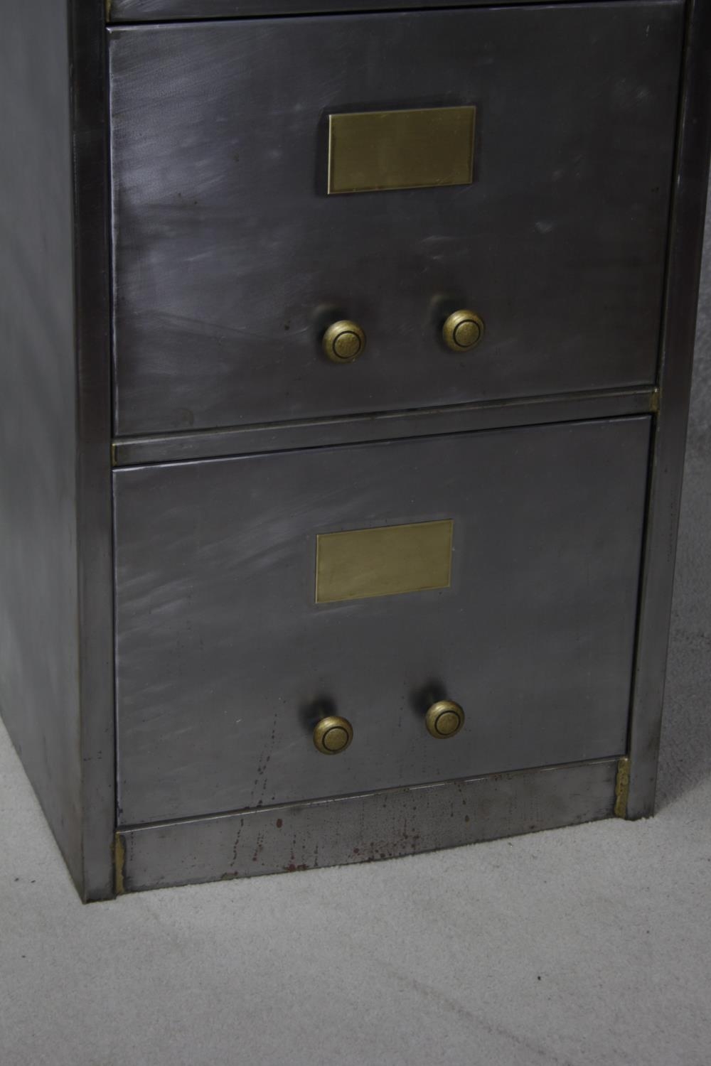 A vintage polished steel filing cabinet with twin brass handles and brass plate to each drawer. H. - Image 4 of 11