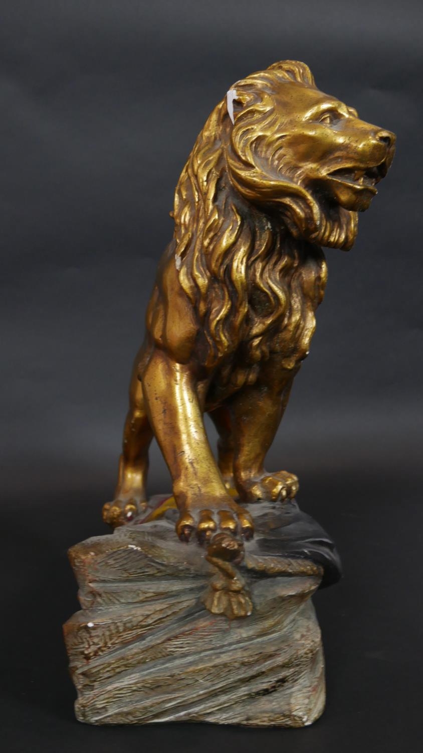 A gold and polychrome glazed ceramic sculpture of a lion roaring and standing on the Belgian flag on - Image 2 of 6