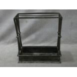 A vintage cast iron stick and umbrella stand with two long sections and lattice design ends. H.62