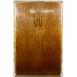 A mid century burr walnut Art Deco style fitted wardrobe on stepped plinth base. H.184 W.120 D.50cm