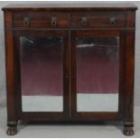 A Regency rosewood chiffonier with lion's mask handles and mirrored doors with original plates