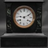 A late Victorian marble and slate mantel clock with white enamel dial flanked by pilasters on plinth