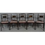 A set of five Regency mahogany brass inlaid dining chairs with rope twist backs and drop in seats on