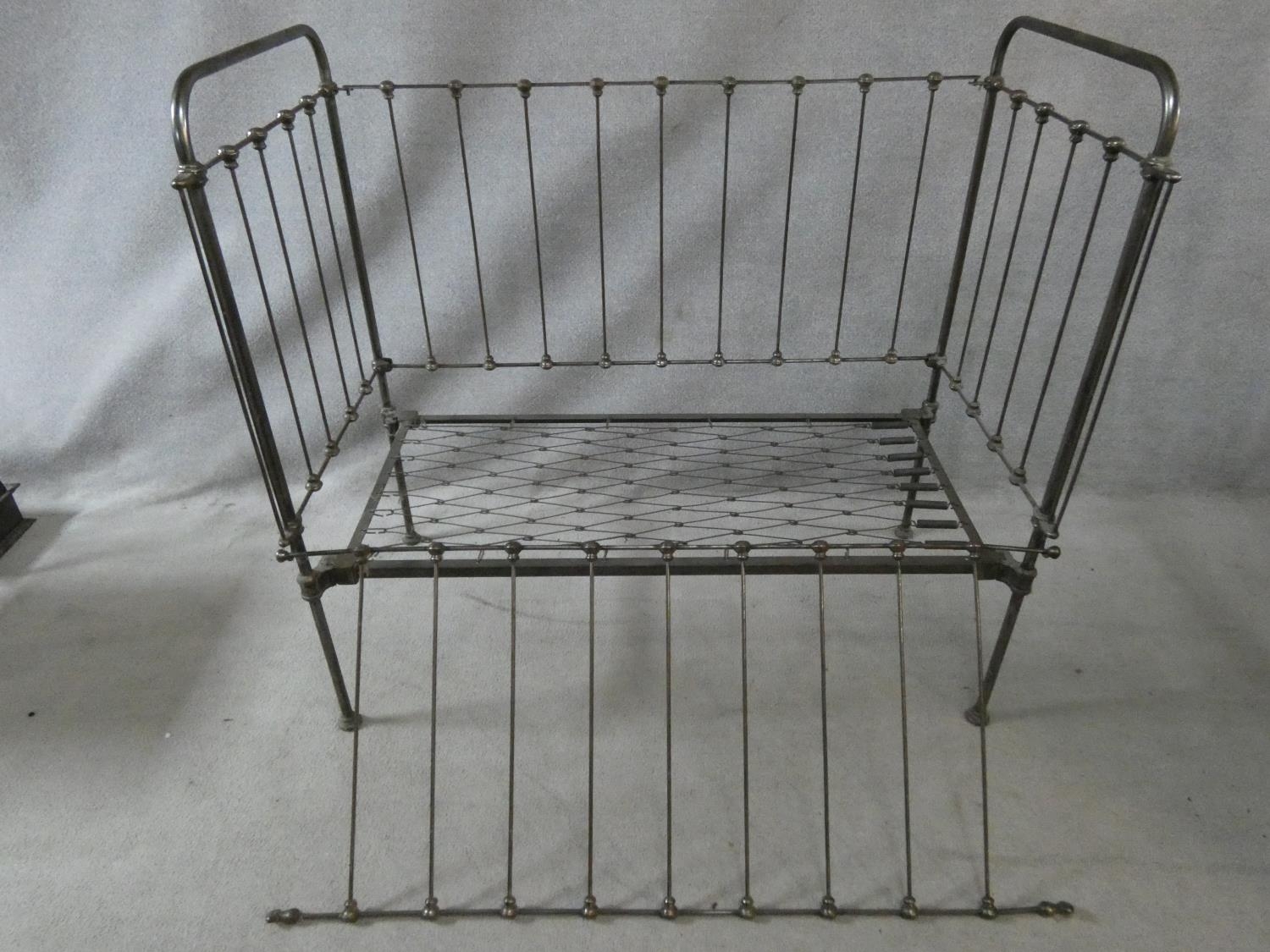 A Victorian wrought iron child's cot with fall front panel. H.114 L.124 W.63cm - Image 4 of 5
