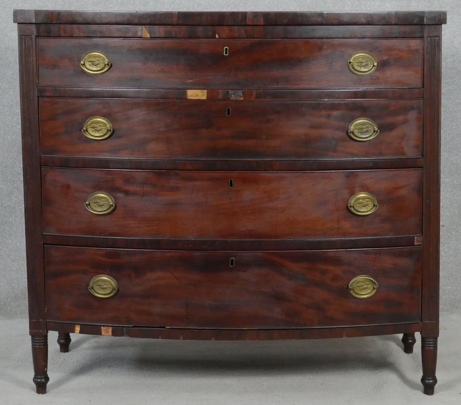 A 19th century mahogany bowfronted chest of four long drawers flanked by reeded pilasters on - Image 2 of 10