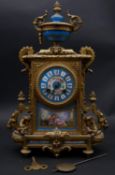 An early 20th century French gilt metal and porcelain mantel clock with eight day movement and
