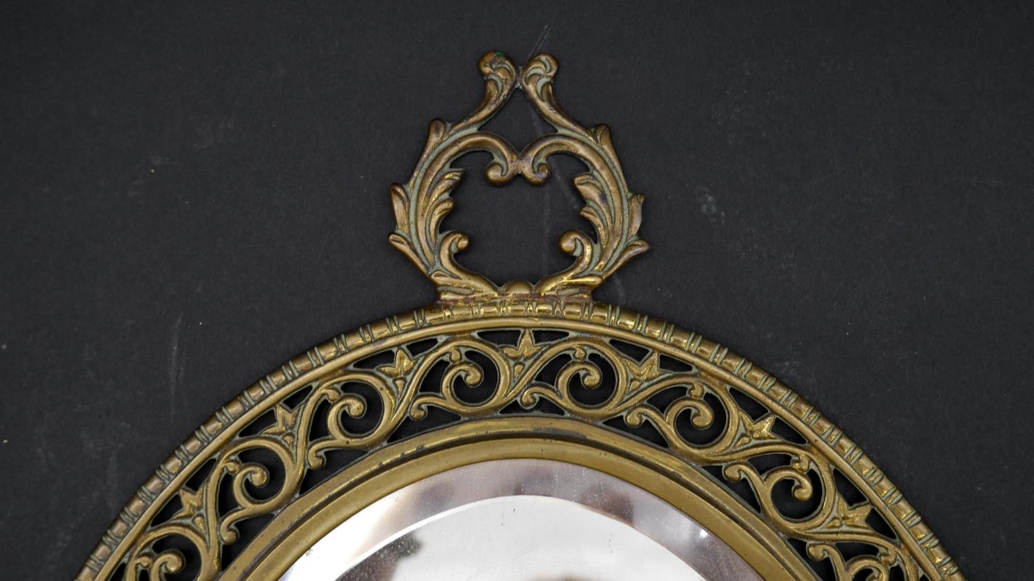 A late 19th century gilt metal twin branch girandole with bevelled plate in pierced floral frame. - Image 2 of 6