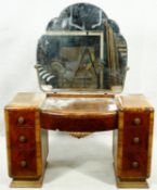 A mid century Art Deco style burr walnut dressing table with cloud shaped bevelled mirror above