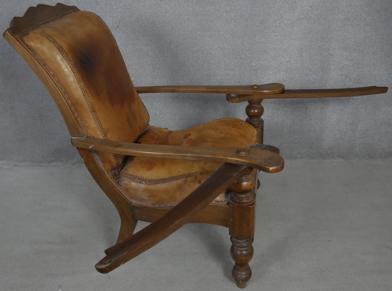 A 19th century teak planter's style armchair with folding leg rests in leather upholstery on - Image 4 of 8