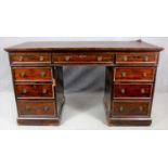 A 19th century three part mahogany pedestal desk with an arrangement of nine drawers on plinth base.