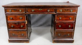 A 19th century three part mahogany pedestal desk with an arrangement of nine drawers on plinth base.