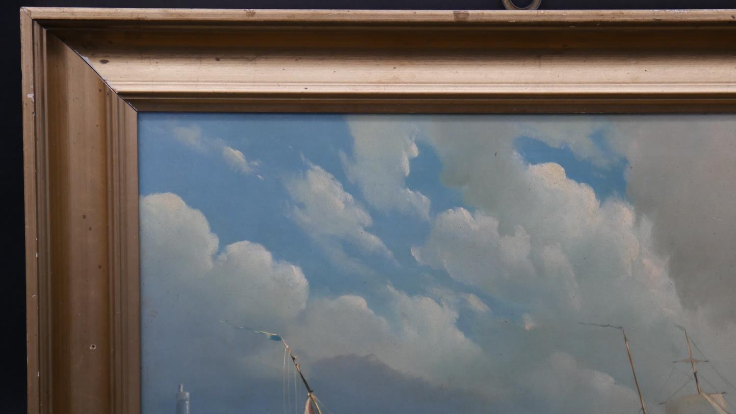 A 19th century gilt framed oil on panel, sailing ships on stormy seas with a lighthouse in the - Image 4 of 5