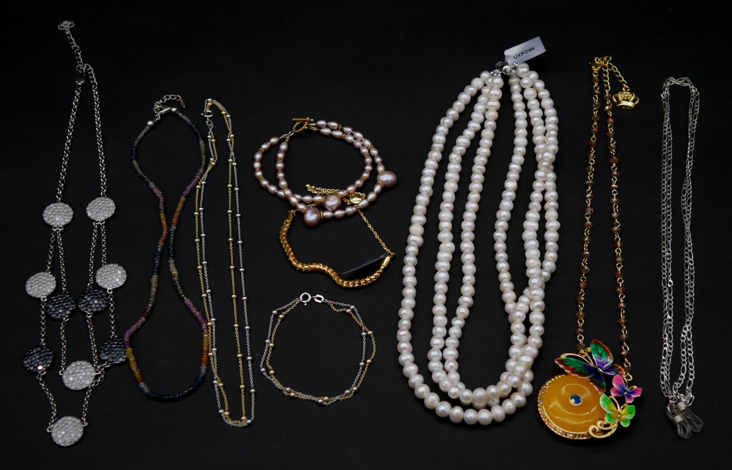A collection of jJewellery. To include a pink freshwater pearl double strand bracelet, a three